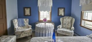 Room with blue walls and comfortable chairs for relaxing