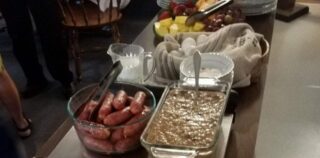 Buffet of casseroles and foods on table