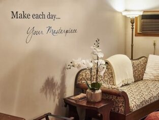 Make each day... Your Masterpiece on wall over sofa